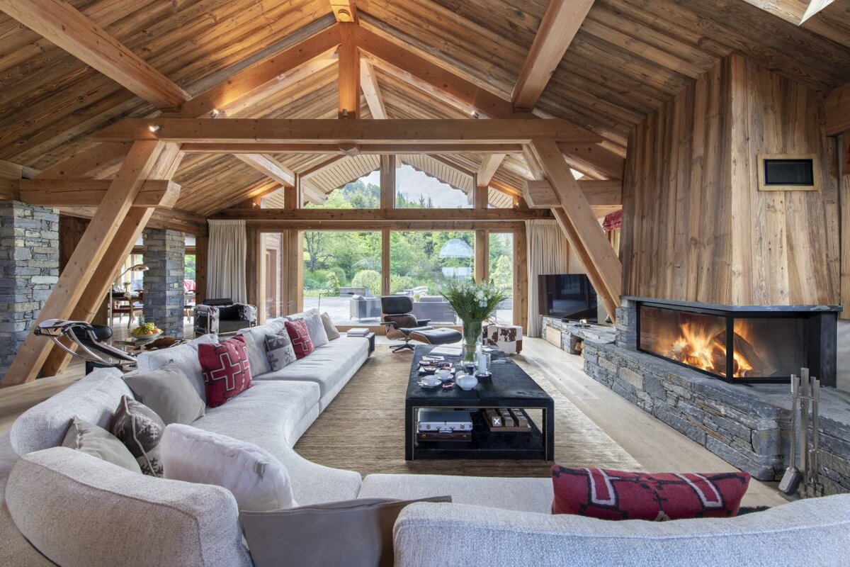 A living room with a fireplace and a large couch