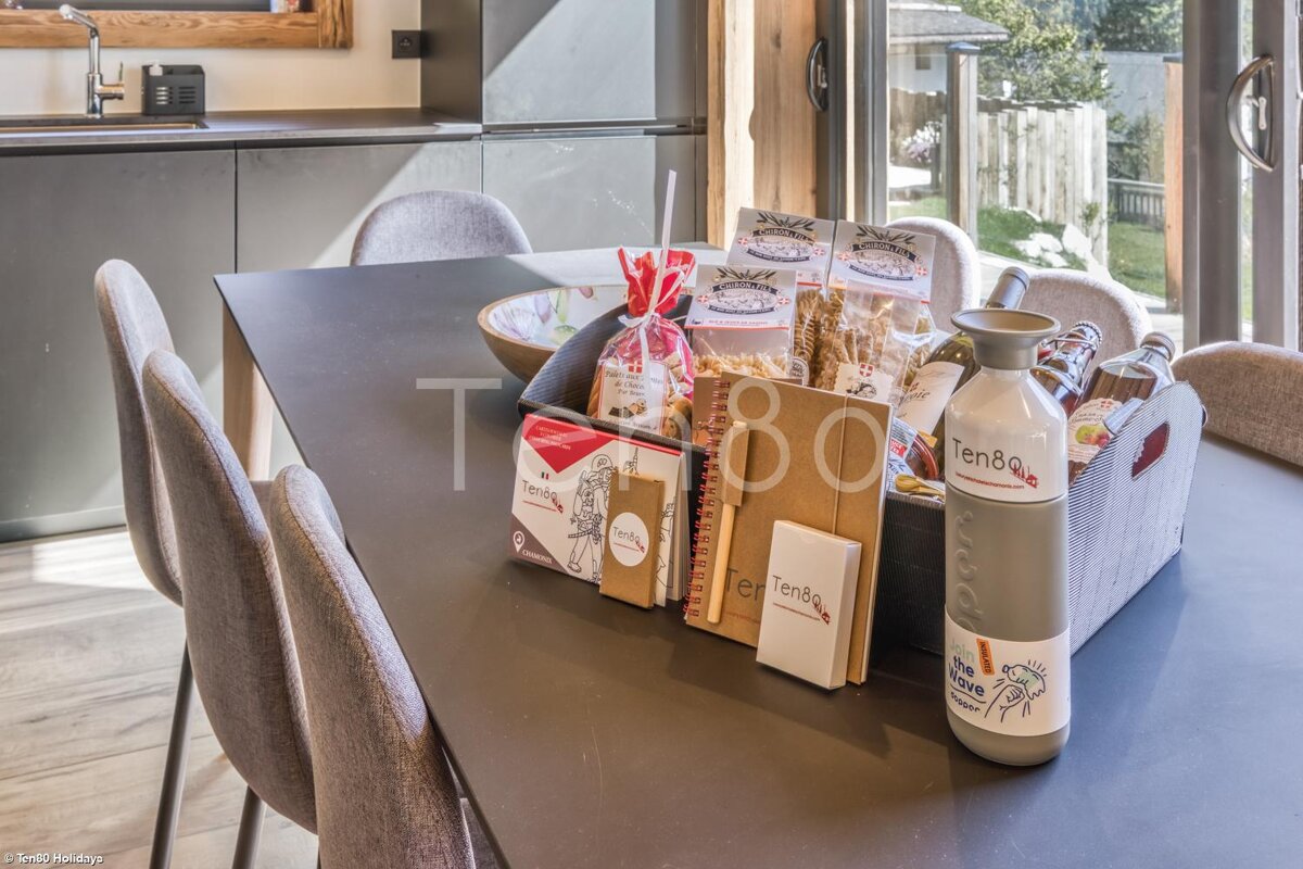 A bottle of ten80 sits on a dining table