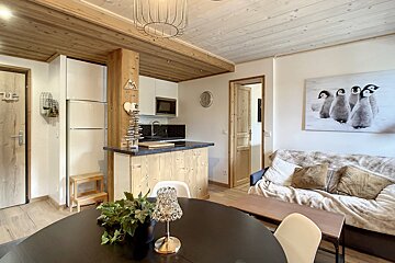 A room with a picture of penguins on the wall