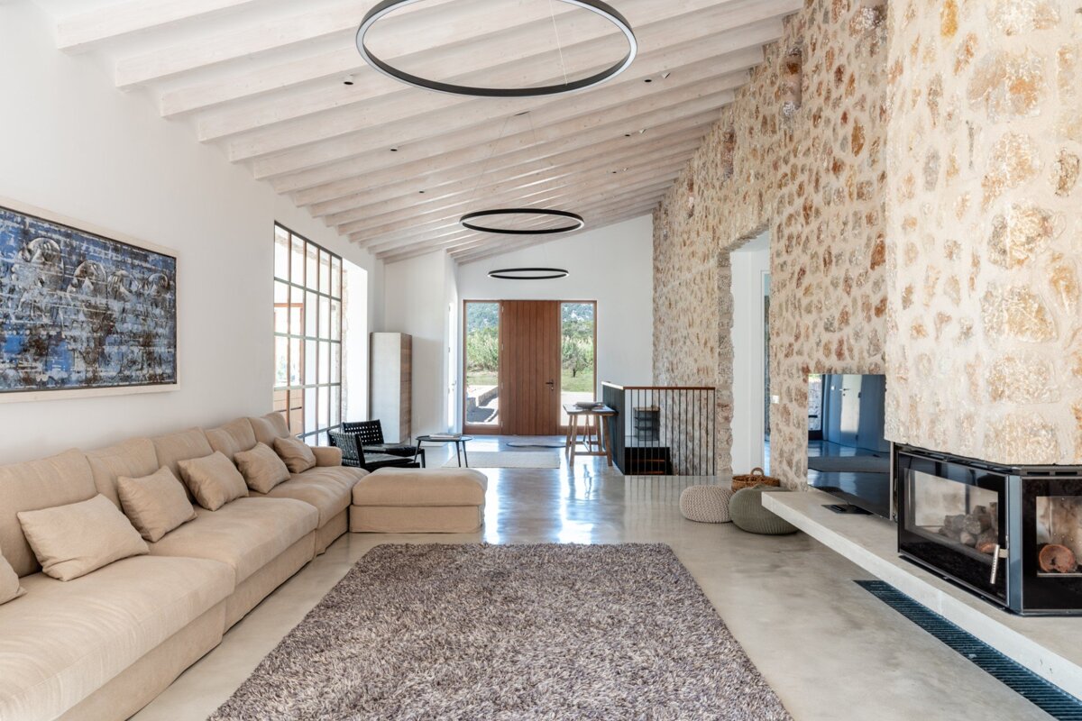 A living room with a couch and a fireplace