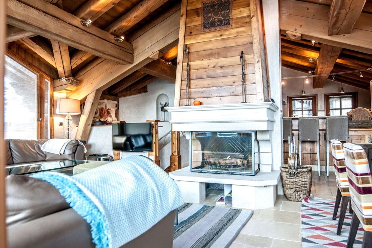 A living room with a fireplace and a couch