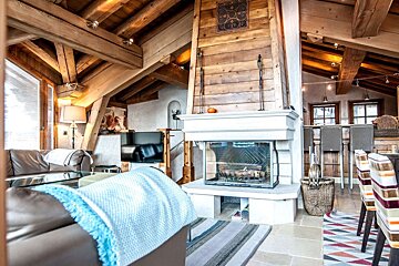 A living room with a fireplace and a couch