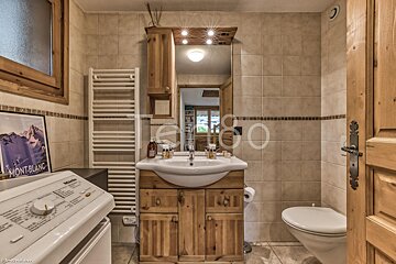 A bathroom with a picture of montblanc on the wall
