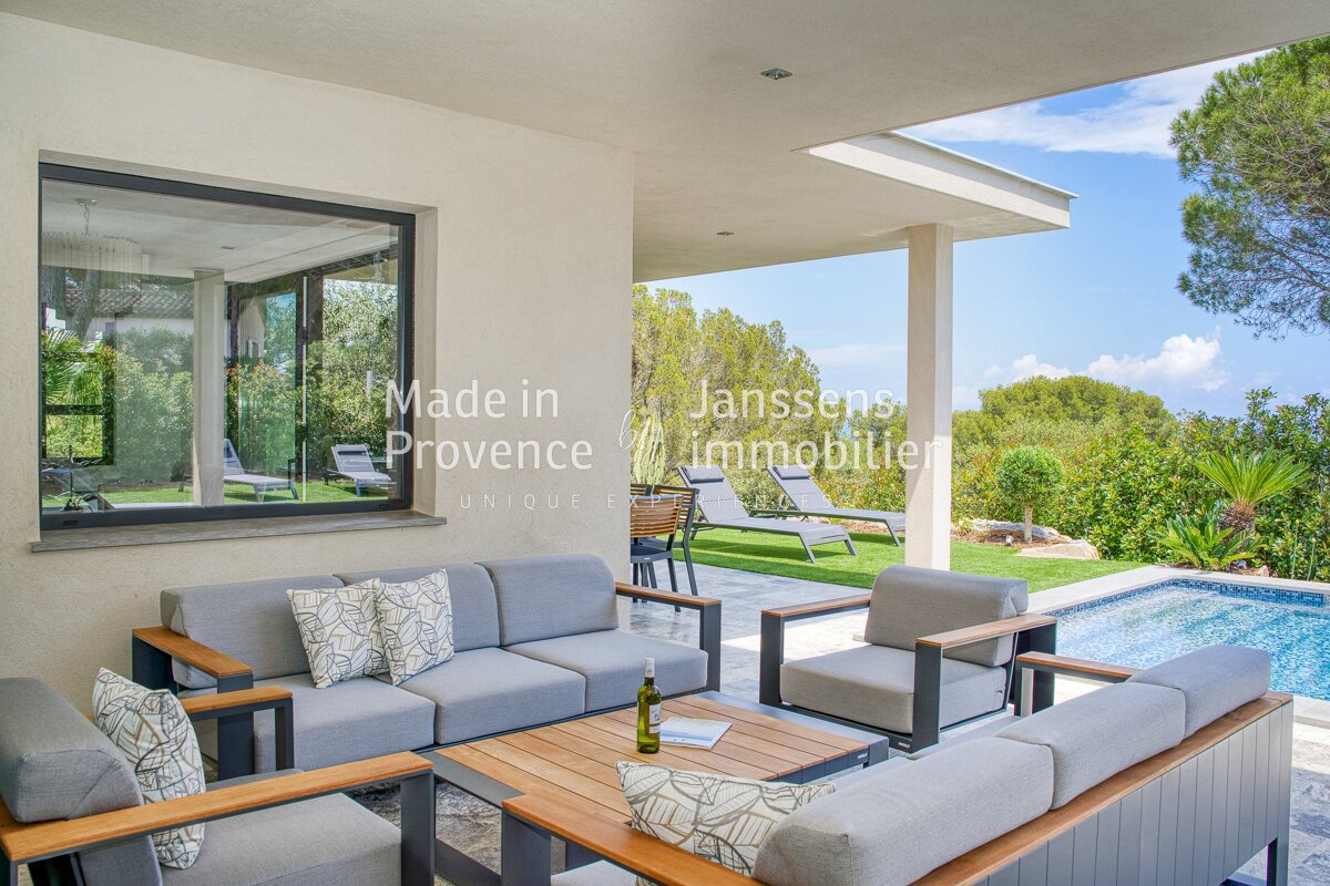 A patio area with a couch and chairs made in provence
