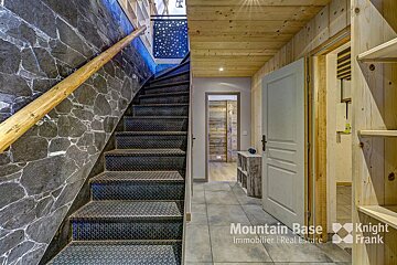 A staircase with the words mountain base knight frank on the bottom