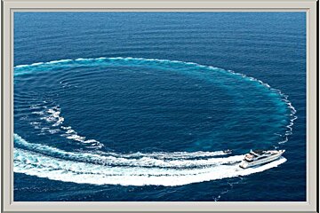 A boat is making a circle in the ocean