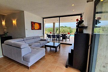 A living room with a couch and a table