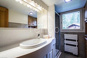 A bathroom with a sink and a window with the word terrabo on it