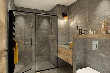 A bathroom with a walk in shower and a toilet
