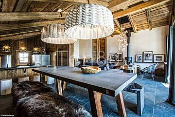 A dining room table with a bowl on top of it