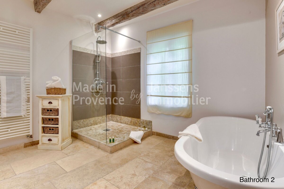 A bathroom with the words made in provence by immobilier on the wall