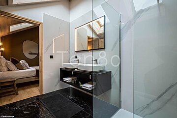 A bathroom with the number 80 on the wall