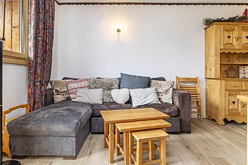 A couch with a lot of pillows on it