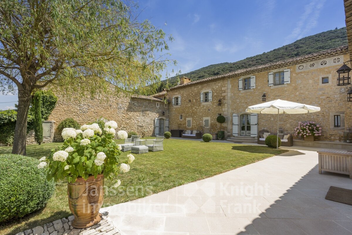 A large stone house is for sale by knight frank