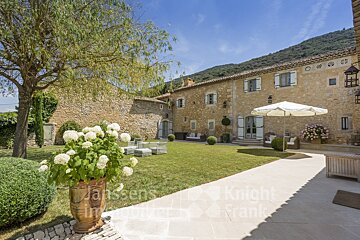 A large stone house is for sale by knight frank