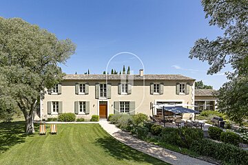 A large house with a large lawn in front of it