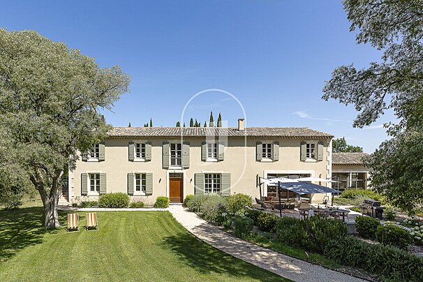 A large house with a large lawn in front of it