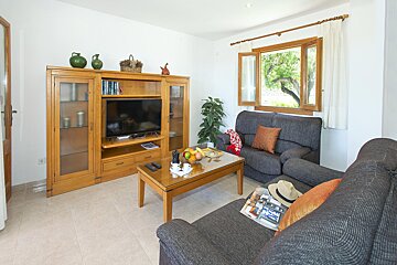 A living room with a couch and a television