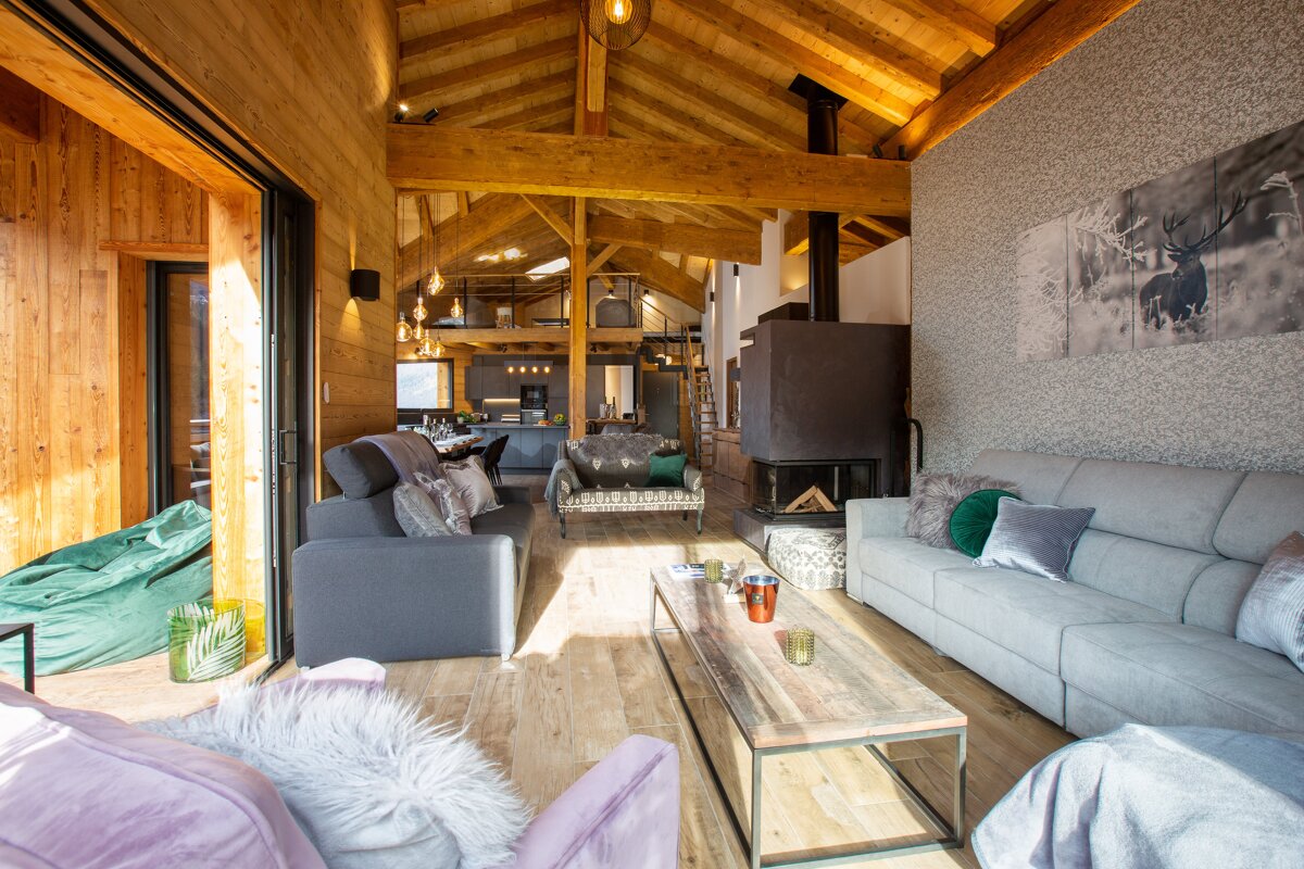 A living room with a couch a chair and a coffee table
