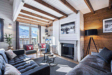 A living room with a fireplace and a couch