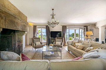 A living room filled with furniture and a fireplace