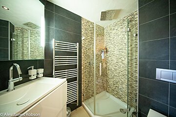 A photo of a bathroom by alex james robson