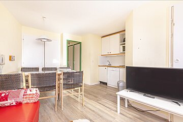 A flat screen tv is sitting on a white table