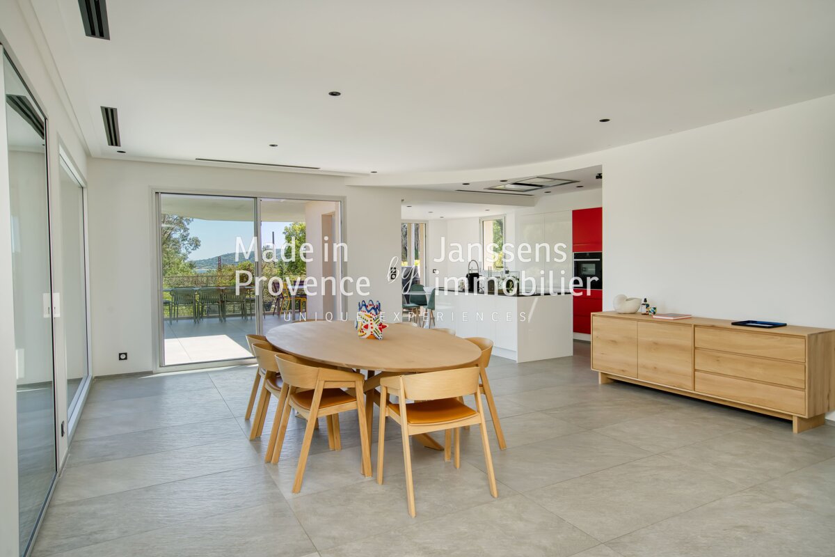 A dining room with a table and chairs made in provence