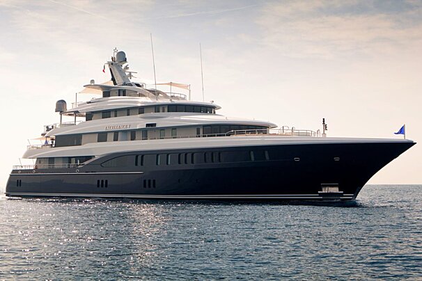 A large black and white yacht with the name explorer on the side