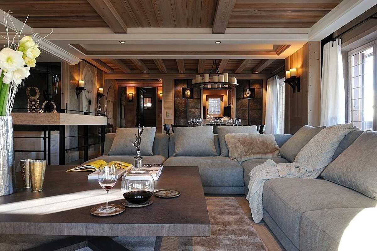 A living room with a sectional couch and a coffee table