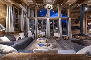 A living room filled with furniture and a fireplace