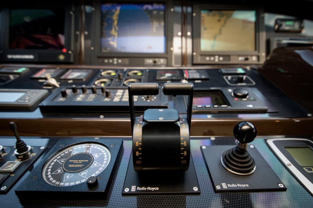 A rolls royce steering wheel is on a boat