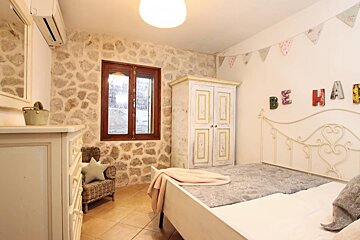 A bedroom with the word be heard on the wall