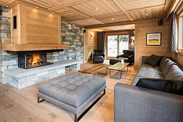 A living room with a fireplace and a couch