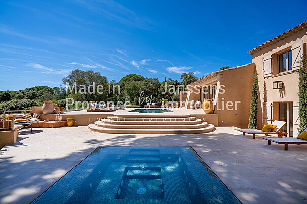 A large swimming pool with the words made in provence below it