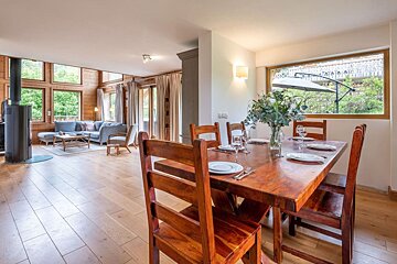 A wooden table and chairs in a living room