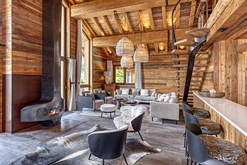 A living room filled with furniture and a fireplace