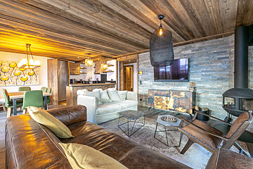 A living room with a couch and a fireplace