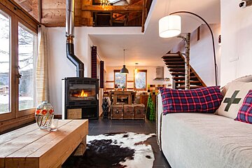 A living room with a couch and a fireplace