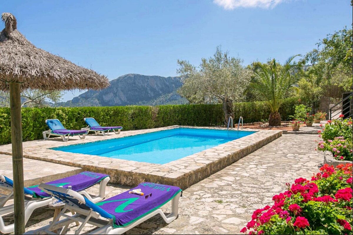 A swimming pool with a blue towel that says ' ibiza ' on it