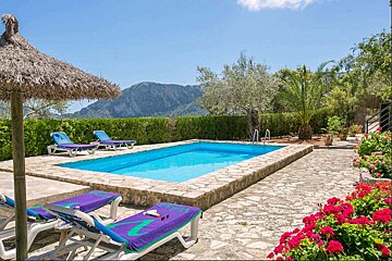 A swimming pool with a blue towel that says ' ibiza ' on it
