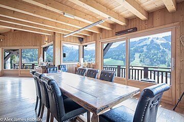 A photo of a dining room table and chairs taken by alex james robson