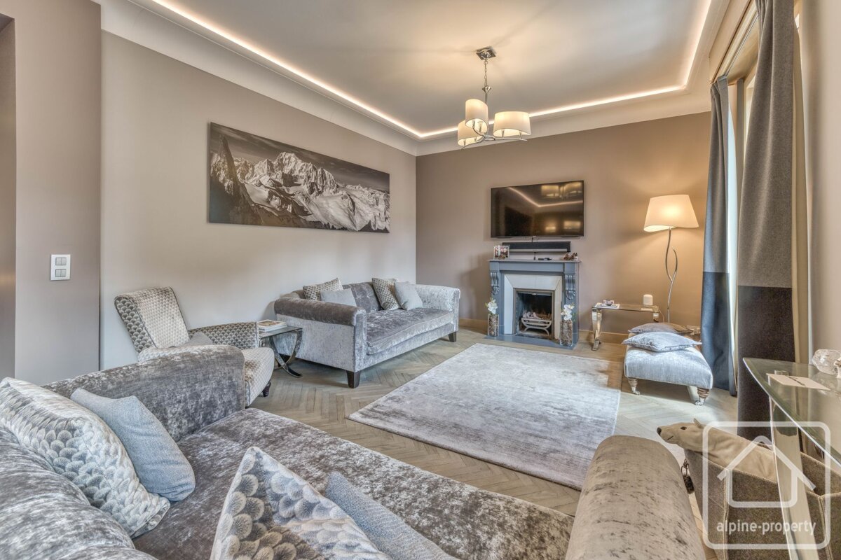 A living room with alpine property written on the corner