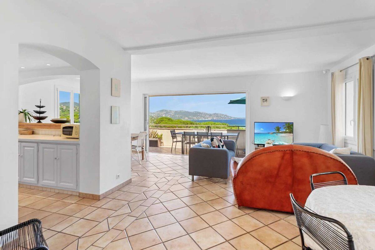A living room with a view of the ocean