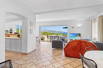 A living room with a view of the ocean