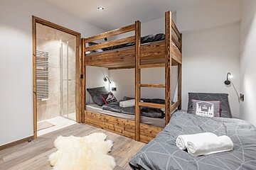 A bunk bed with a pillow that says cable cab on it