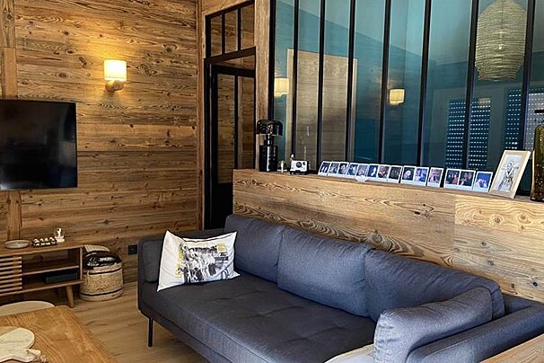 A living room with a couch and a television