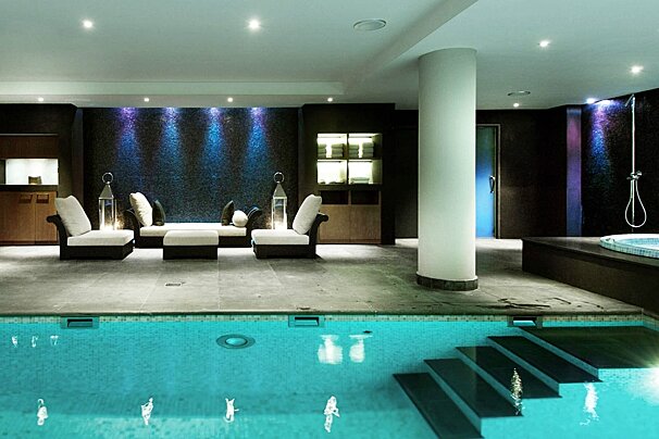 A swimming pool with stairs leading up to it