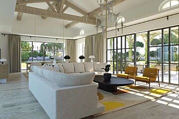 A living room with a white couch and yellow chairs