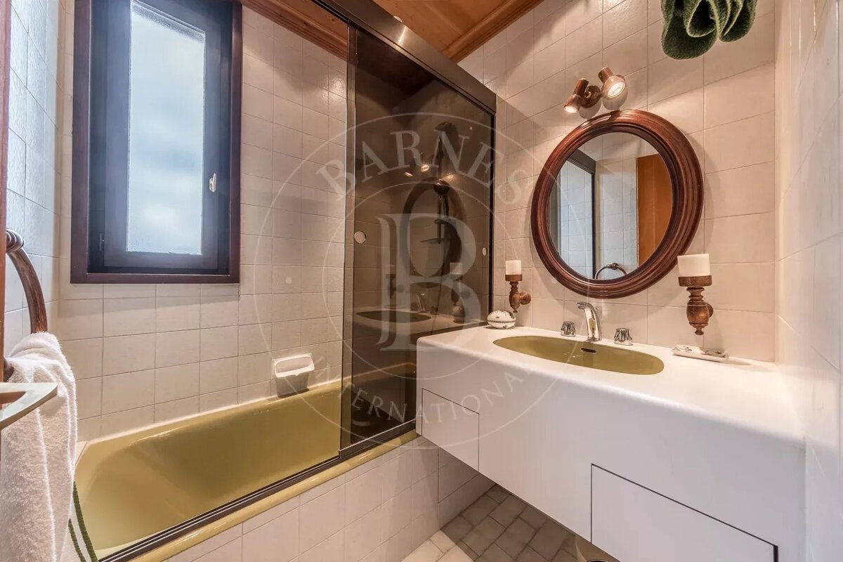 A bathroom with a sink and a mirror that says barnes international